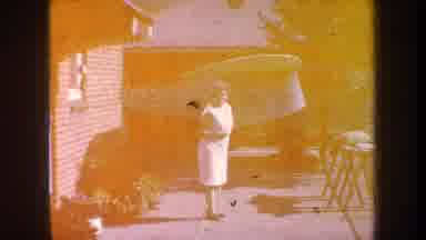 Volmer Yucaipa California USA (1969): A Woman Who Is Watching Curiously Over