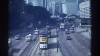 Hong Kong-1982: Crowded Traffic Streets Filled With Cars And Street Trolley