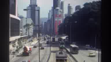 Hong Kong (1982): City Street Scene With Skyscrapers Cars And Trolleys