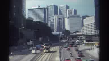 Hong Kong (1982): Cars Motorcycle Buildings City Bus Truck Road People Double