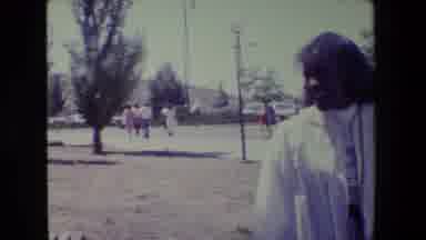 Lansing Michigan (1983): Women Graduating Outside In A Cap And Gown With Her