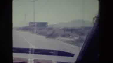 San Francisco California (1984): A Car Drives Down A Road In Front Of A Tan Car