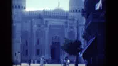 Cairo Egypt (1946): People Walk Past Iconic Building With A Nice Blue Sky