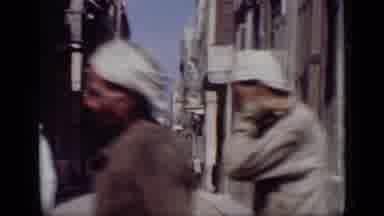 Cairo Egypt (1946): Middle Eastern People Walking Around An Old Town And A Person