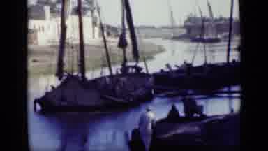 Cairo Egypt (1946): People Peacefully Sailing On A River Next To A Village