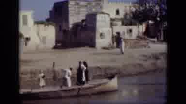 Cairo Egypt (1946): Boating On A Body Of Water Through A Village