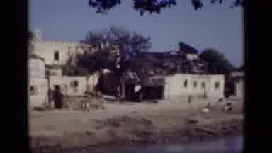 Cairo Egypt (1946): View Of Person Walking Past White Beach Building On Bright