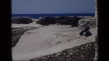 CAIRO EGYPT-1946: Ancient Stone Ruins Partially Buried in Sand Overlooking the Sea