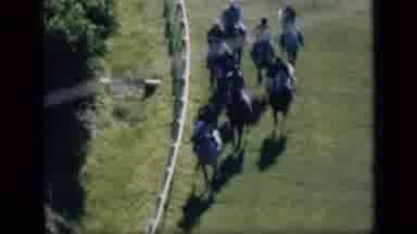 Cairo Egypt (1946): Group Of Jockeys Racing Horses Along Side A White Fence At A