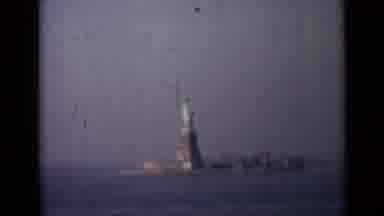 London England (1946): A View Of The Statue Of Liberty From A Vehicle Passing By