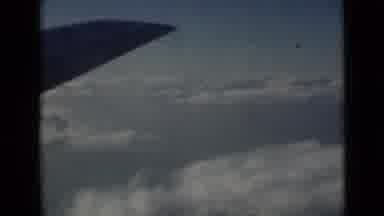 London England (1946): Airplane In Flight Clouds Airplane Wing Travel Day