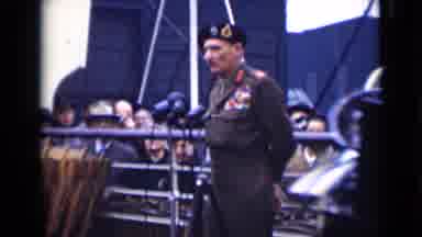 London England (1946): A German Military Man Standing With Crowd In The Background