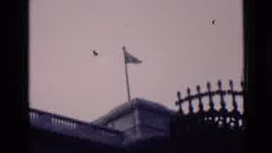 London England (1946): Old Footage Of A Flag On Top Of A Building Blowing And