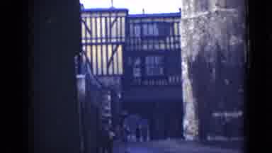 London England (1946): City People Walking On Road With Buildings Medieval