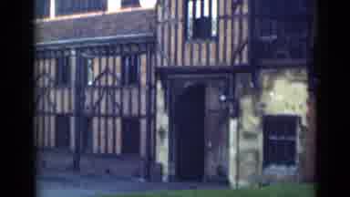 LONDON ENGLAND-1946: Old Footage Of A Timber-Framed Building With An Iron Fence