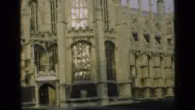 London England (1946): A Church And A Grass Field Are Shown During The Day Time
