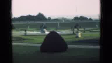 London England (1946): A Graveyard Is Filled With Statues And Shrubs Followed By