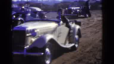 San Diego California USA (1949): Cream Colored Classic Car Starts From Standstill