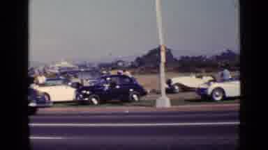 San Diego California USA (1949): Red White Blue Vintage Cars Parked Along Highway