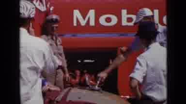 San Diego California USA (1949): People Putting Gas Into What Seems A Tractor