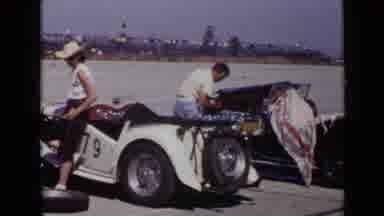 San Diego California USA-1949: Man Fiddling With His Very Powerful Cars For