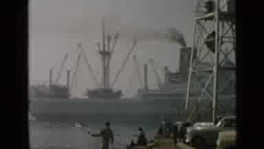 San Diego California USA (1949): Huge Steam Boat Slowly Cruising Past A Group Of