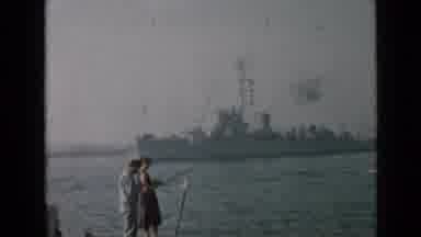 San Diego California USA (1949): A Couple Fishing In Shore As A Big Boat