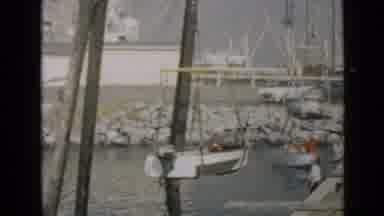 San Diego California USA (1949): Boat Being Lowered By Crane Into Water Next To