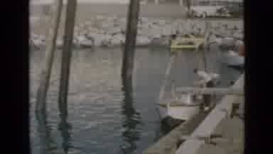 San Diego California USA (1949): Old Video Of Two People Tying Up A Boat At A Dock