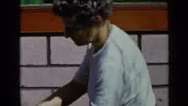 San Diego California USA (1949): A Tall Man Is Seen Playing With A Black Dog