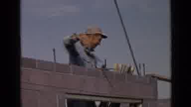 San Diego California USA (1949): Mason Laying Concrete Bricks On A Construction