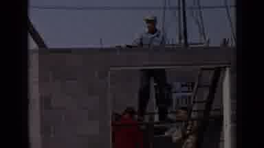 San Diego California USA (1949): A Man Lays Bricks Into A Structure