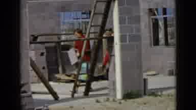 San Diego California USA (1949): Women Walking Black Dog Through Construction Site