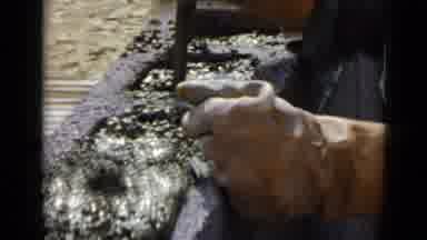 San Diego California USA (1949): A Man Works With A Tool To Put Cement Into Cinder
