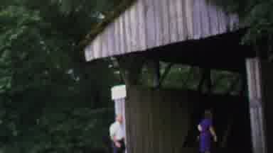 Washington DC USA-1969: Three People Entering A Wooden Covered Bridge