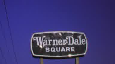 Washington DC USA (1969): A Business Sign Stands Against A Blue Sky Followed By