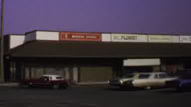Washington DC USA (1969): Two Door Red Late Model Car Reversing From Parking Space