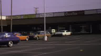 Washington DC USA (1969): Man Pacing Past Vehicles In A Parking Lot