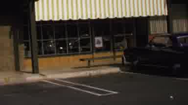 Washington DC USA (1969): A Car Is Parked Outside A Building With Many Glass Panes