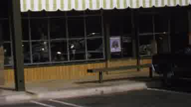 Washington DC USA-1969: View Of Man Walking Past Navy Color Car And Empty Storefront