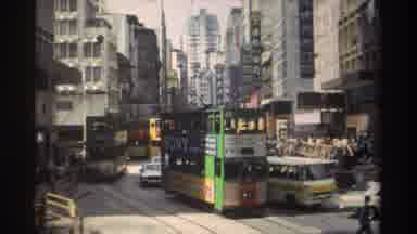 Hong Kong (1982): Green And Yellow Double Decker Electric Streetcars On A Bright