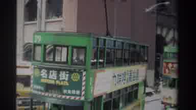 Hong Kong (1982): Two Trams Running Ahead And A Bus Is Crossing In Front