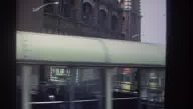 Hong Kong (1982): Bus Rolls By A Crowded City Street Showcasing Different Modes Of
