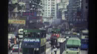 HONG KONG-1982: Busy City Street Littered With Automobiles Double-Decker Bus