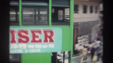 Hong Kong (1982): Double Deck Tram Is Passing Through And A Vegetable Seller Is
