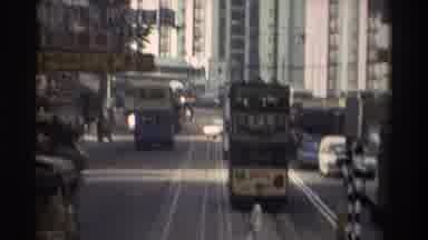 Hong Kong (1982): Trolley Navigates The Streets Of A Busy Metropolitan Center