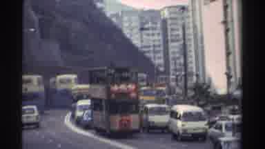 Hong Kong (1982): Busy City With Cars And Trains Roaming Throughout The Streets As