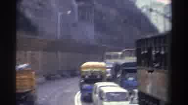 Hong Kong (1982): Vehicles Slowly Moving Through Traffic