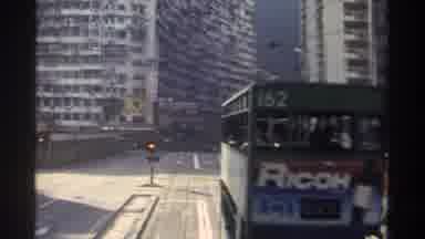 Hong Kong (1982): Bus Transit To Gasoline And Electric Personal Cars Crossing The