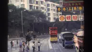 Hong Kong (1982): Tram And Other Vehicles Are Moving Slowly Through The City